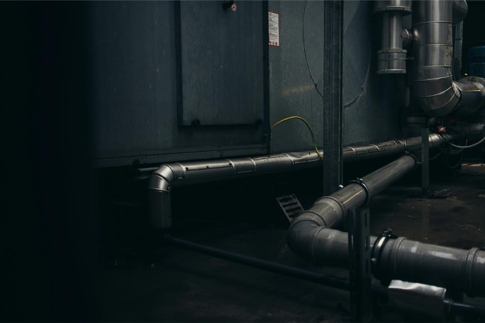 Industrial pipes in dark room