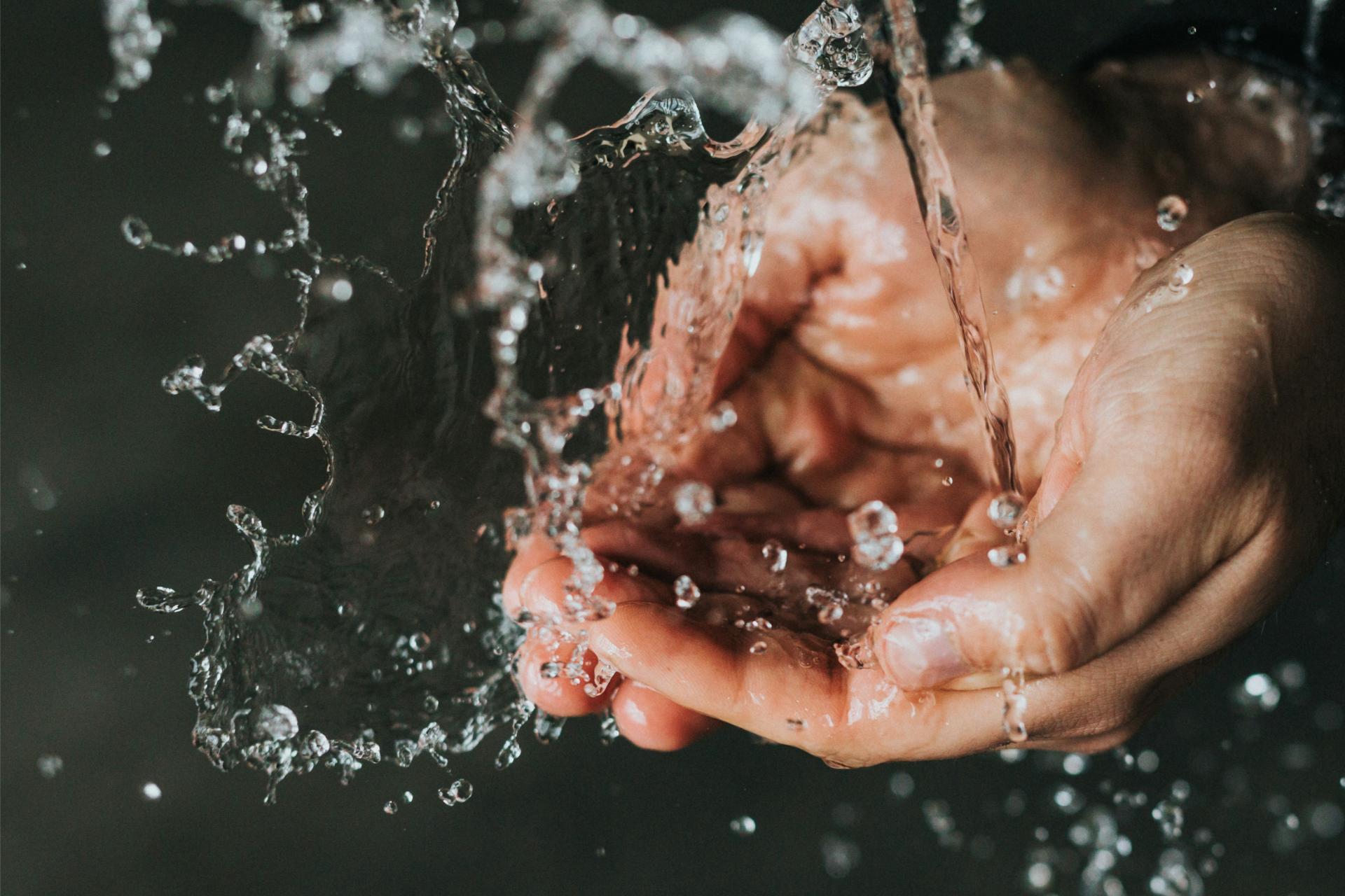 Hands cupped full of clear water